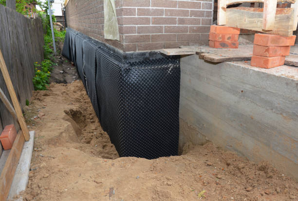 SJ Waterproofing Pros technician performing targeted Emergency Waterproofing assessment in Bloomingdale, MI